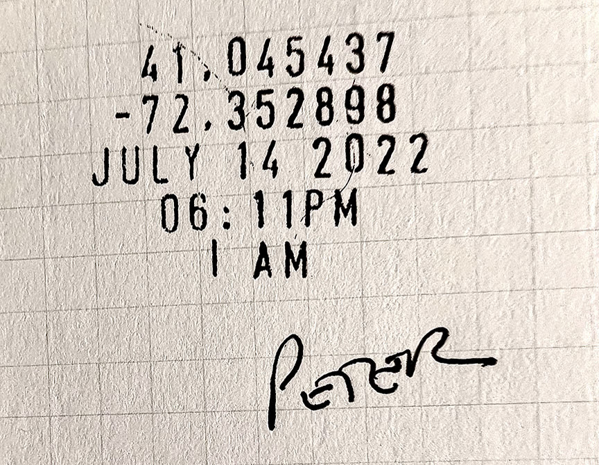 Black ink stamp on grid paper reading 41.045437, -72.352898, JULY 14 2022 / 06:11PM, and I AM.